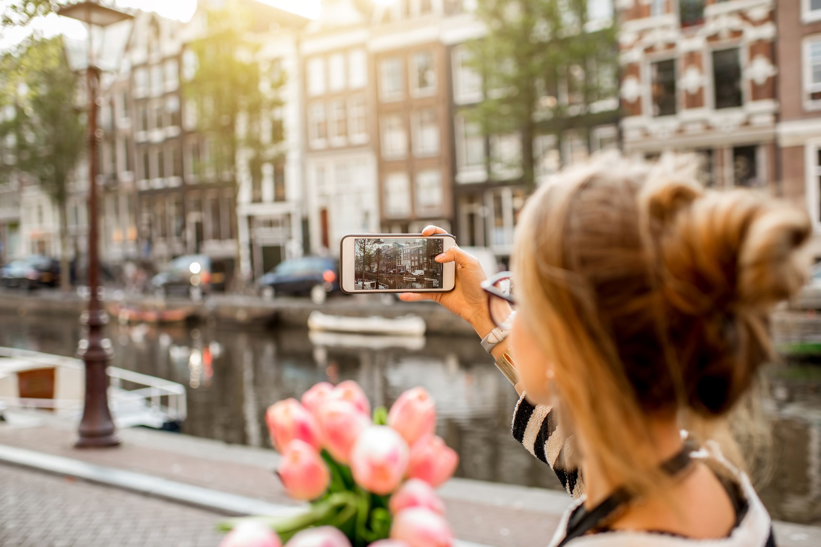 Woman in Amsterdam taking photo